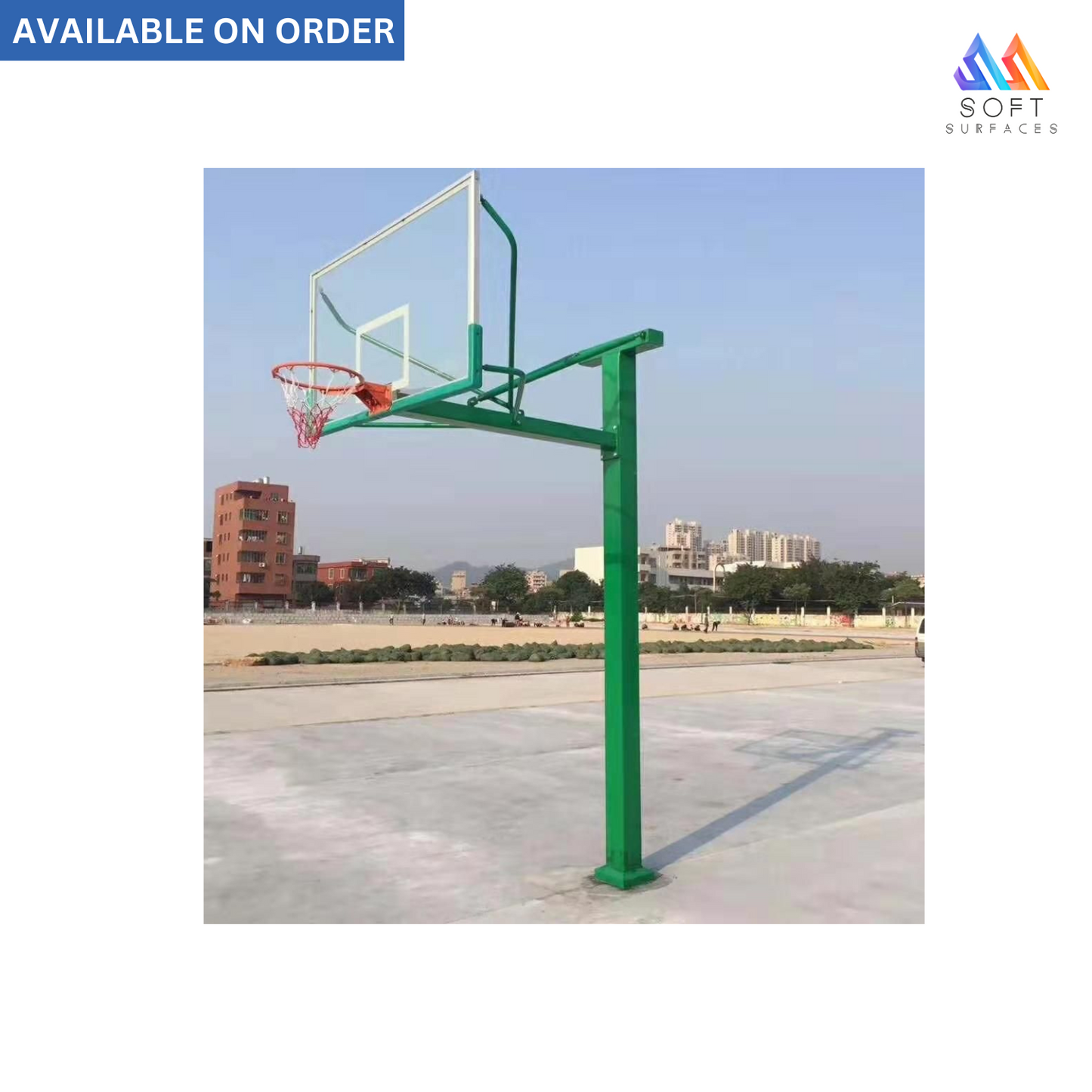 An in-ground basketball stand with a green aluminum alloy frame and a red hoop, located on an outdoor court.