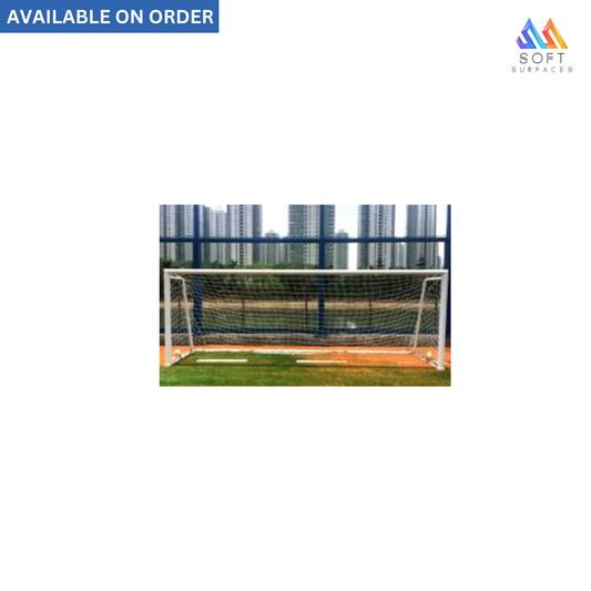 Portable aluminum soccer goal with wheels and a black net, set on an orange ground surface, with a blue sky and trees in the background.