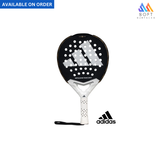 Adidas padel racket with black and white color scheme, featuring the Adidas logo, available on order with a wrist strap included.