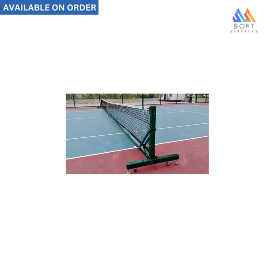 A portable tennis post with net set up on a tennis court